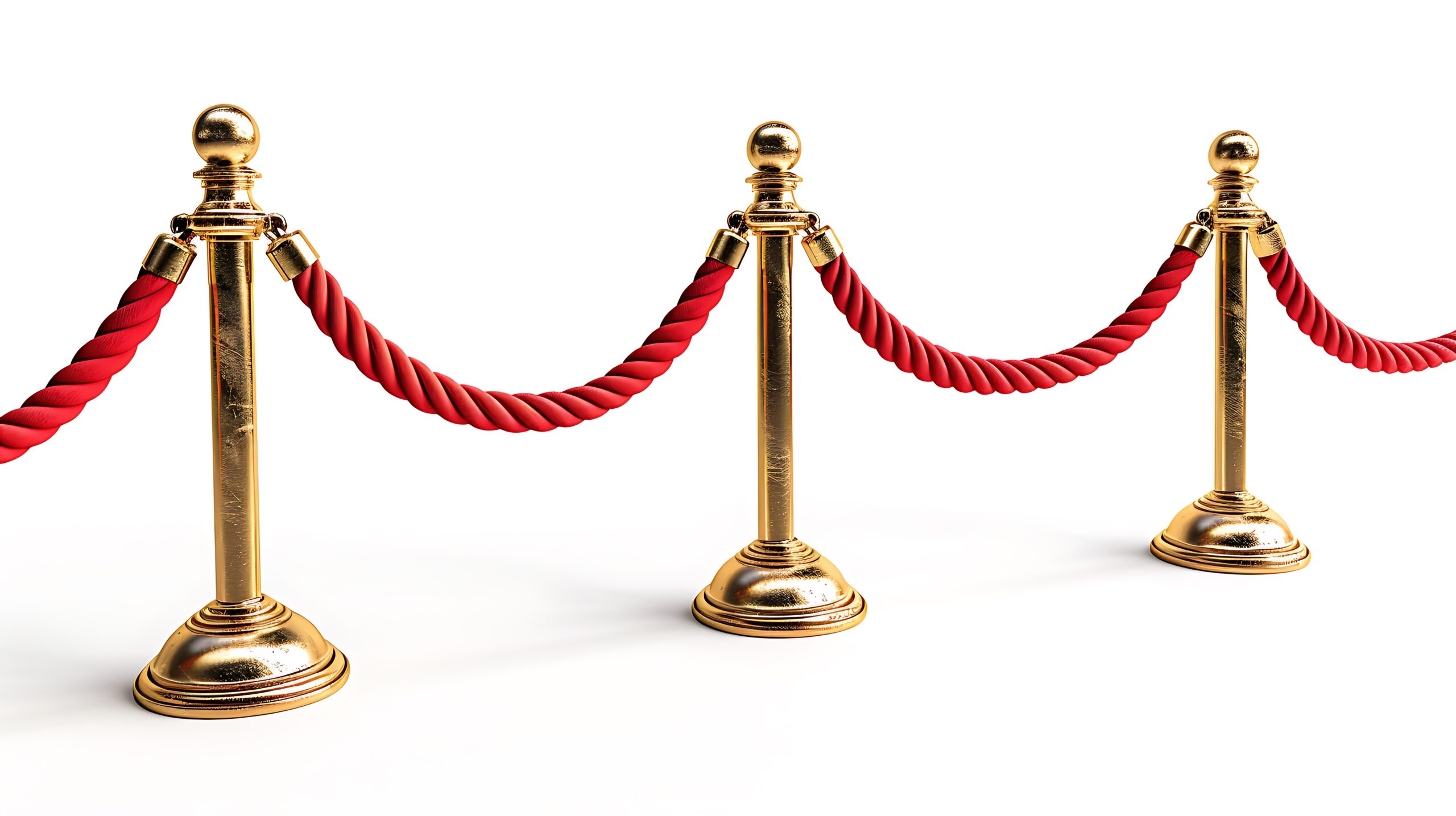 three barrier with gold posts and a red velvet rope